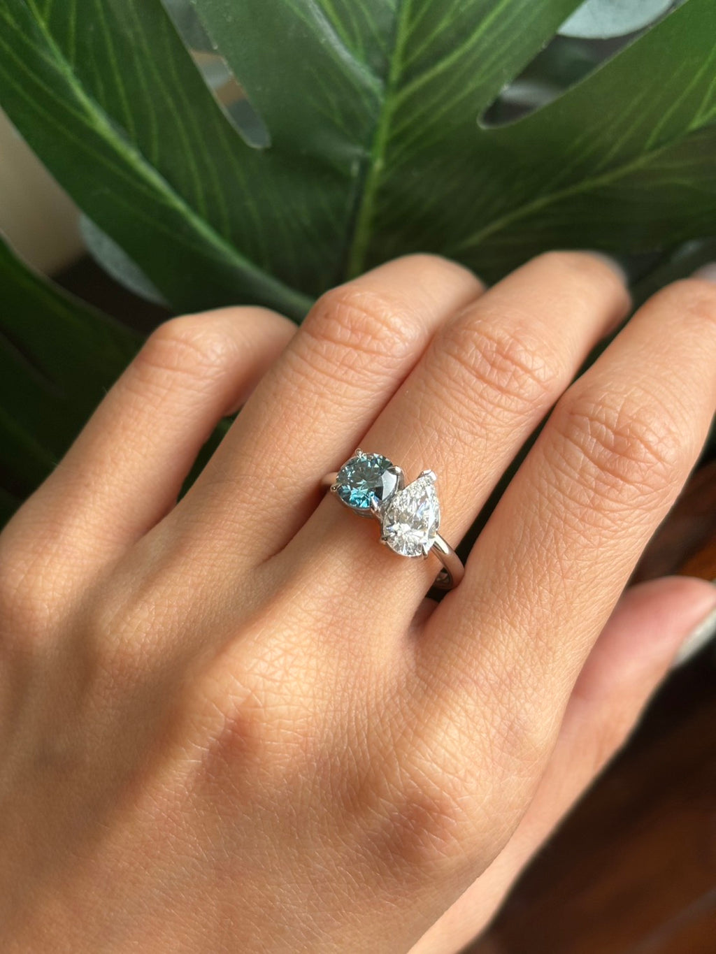 Close-up detail of vivid blue and white lab-grown diamonds on 47AU Toi et Moi ring in Platinum 950