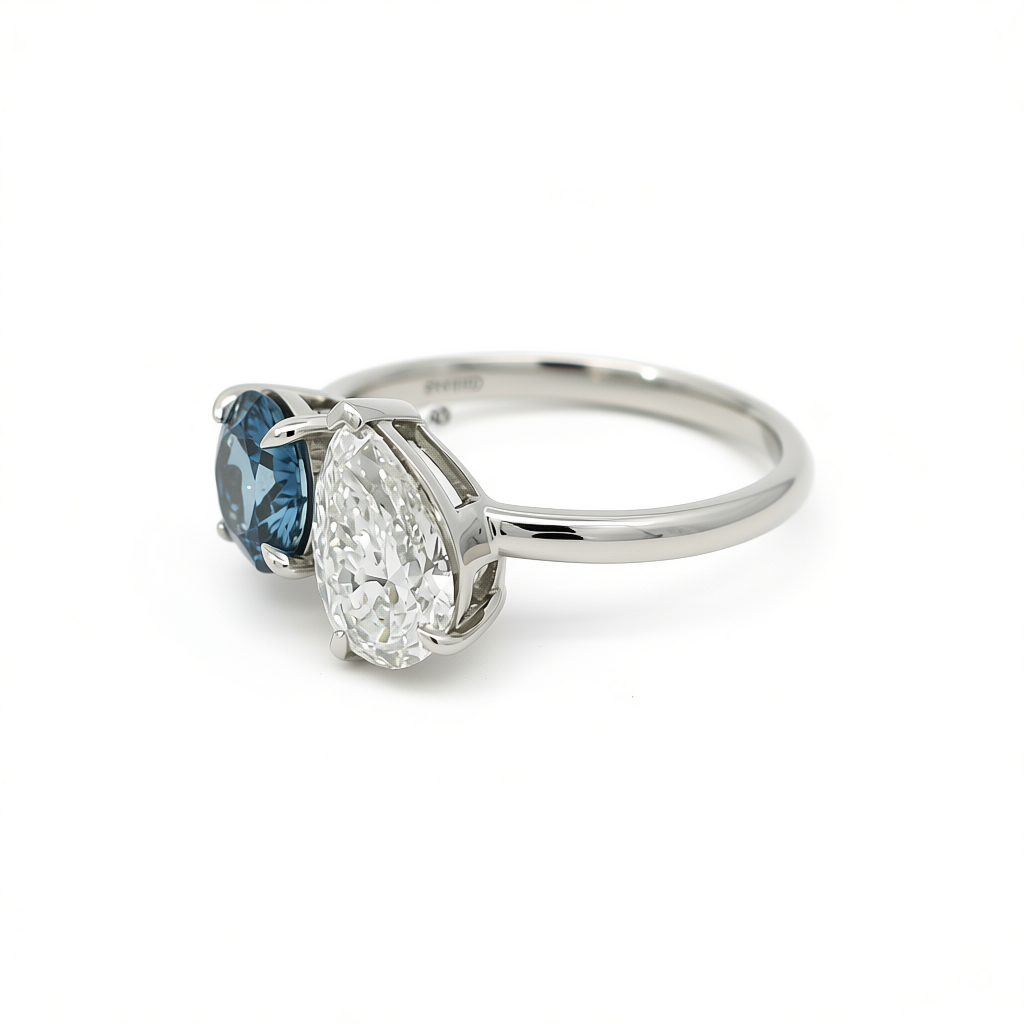 Side profile of 47AU Platinum 950 Toi et Moi ring with vivid blue and white lab-grown diamonds
