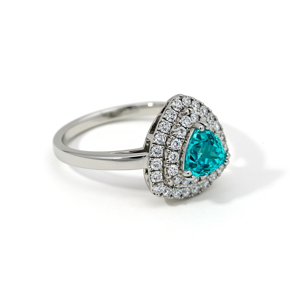 Angled view of 47AU 1.38 ct trilliant synthetic Paraiba tourmaline imitation ring in 10K white gold with 0.45 ct lab-grown diamond triple halo
